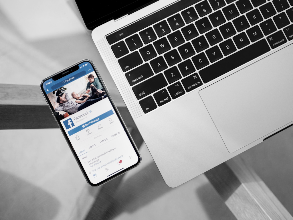 photo of iphone x beside macbook